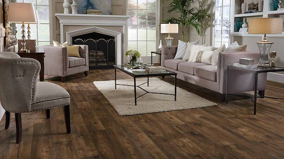 beautiful wood look laminate in an charming living room with a fireplace